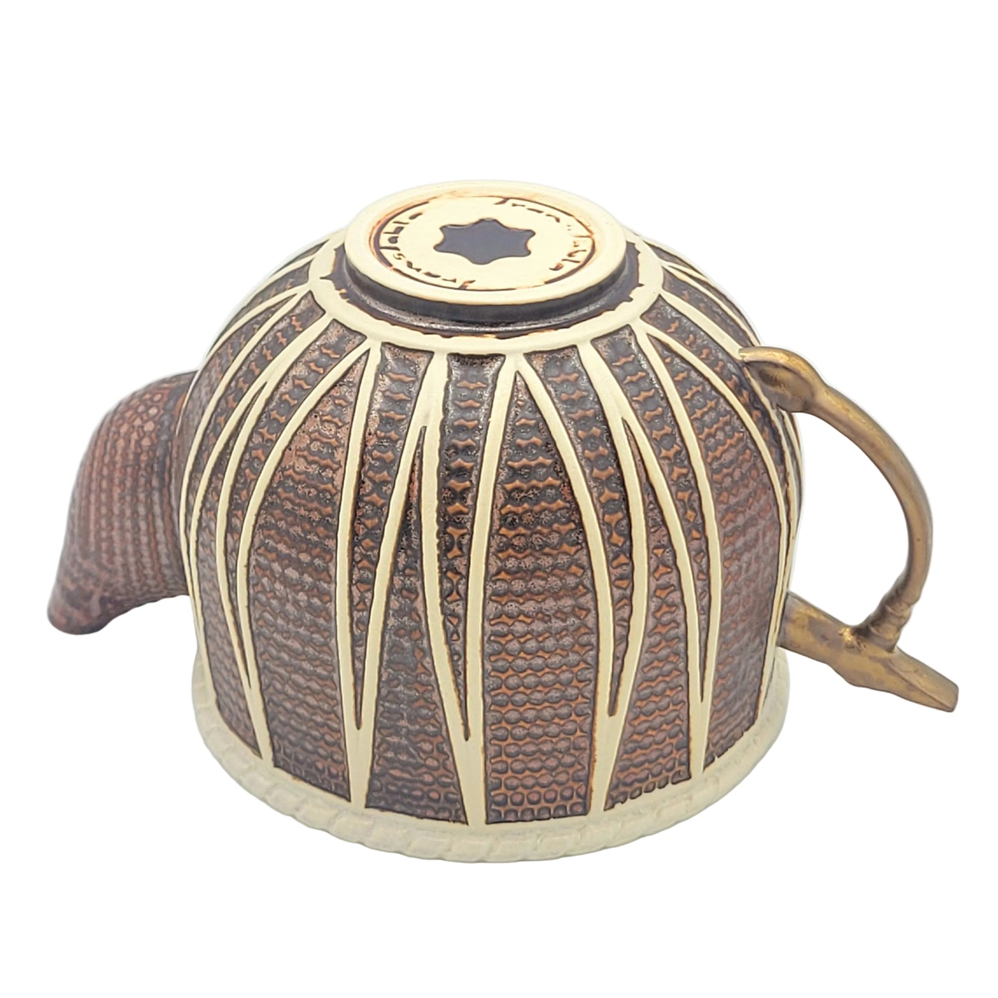 A decorative ceramic teapot with copper colored glaze, featuring a curved spout, a tabla hammer gold glazed handle, viewed from the bottom.