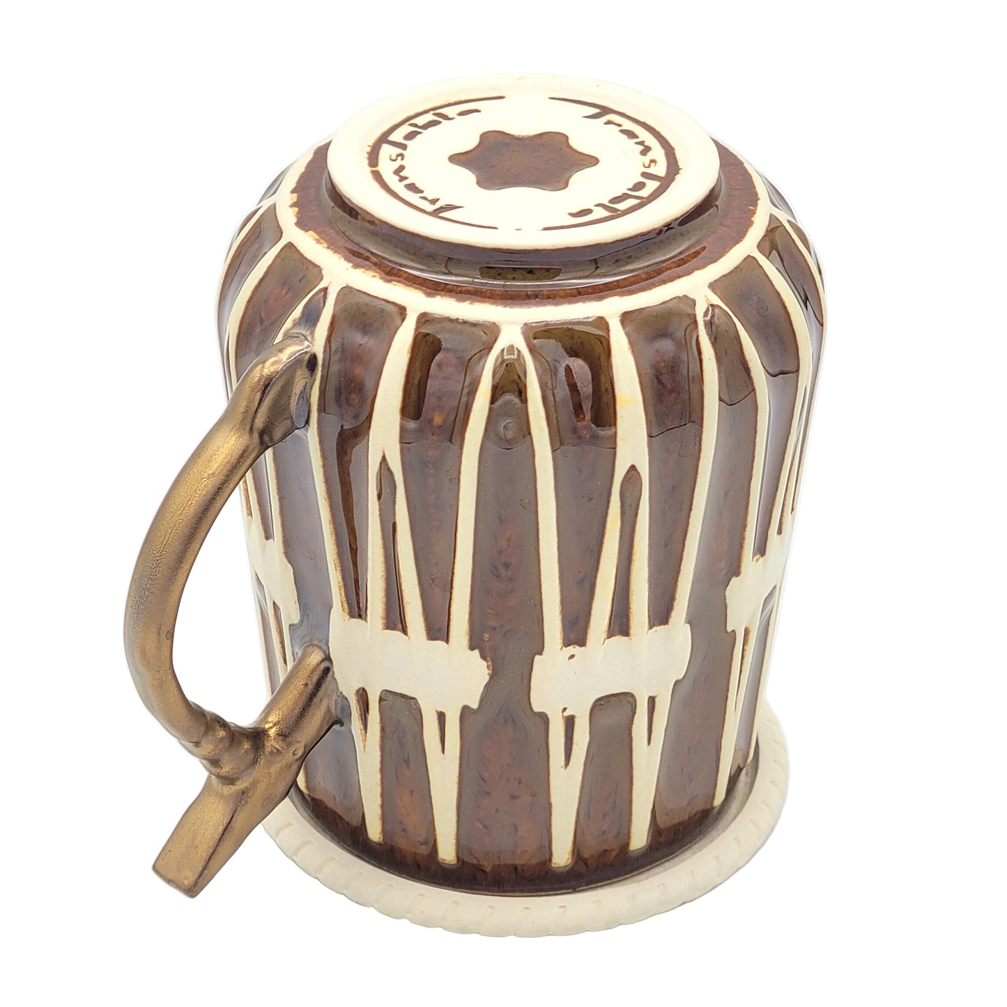A ceramic mug with a brown and cream drip glaze pattern, featuring a gold-toned metal handle and a matching lid on top, set against a white background.